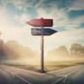 How To Choose? United Integrity Group helps clients navigate Medicare Supplement Plan options, represented by a split road.